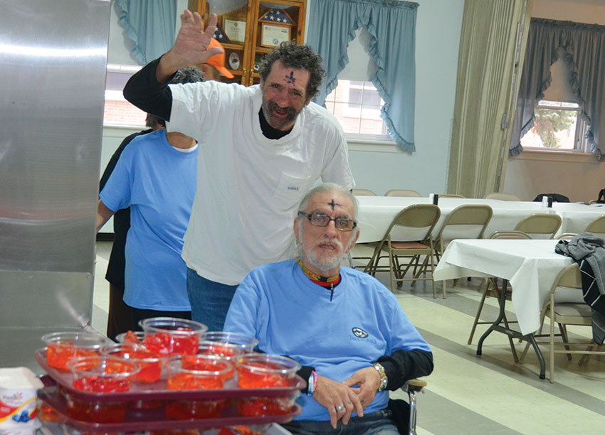 Community members prepare for the Table of Grace meal at Essex UMC.